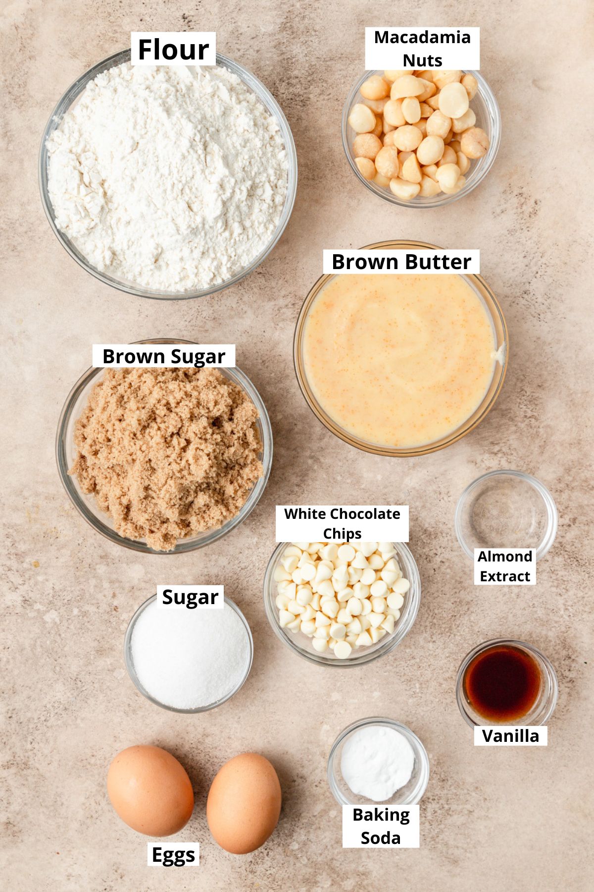 labeled ingredients for white chocolate macadamia nut cookies.