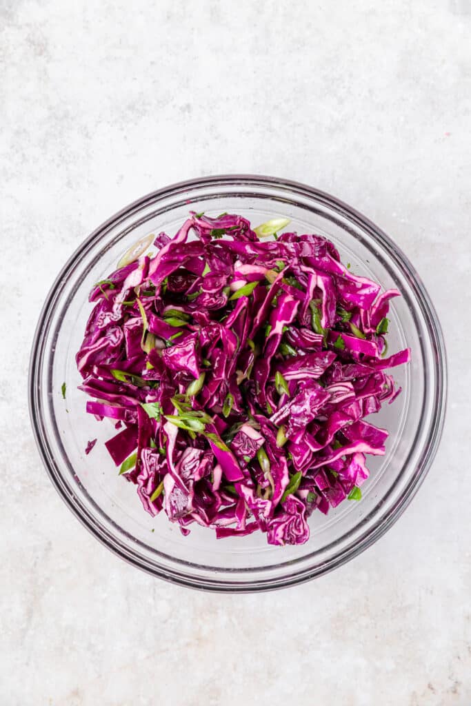 bowl of lime and red cabbage slaw for tacos.