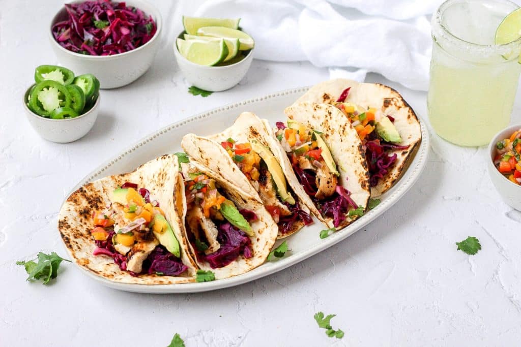 grilled chicken tacos with mango salsa and cabbage slaw