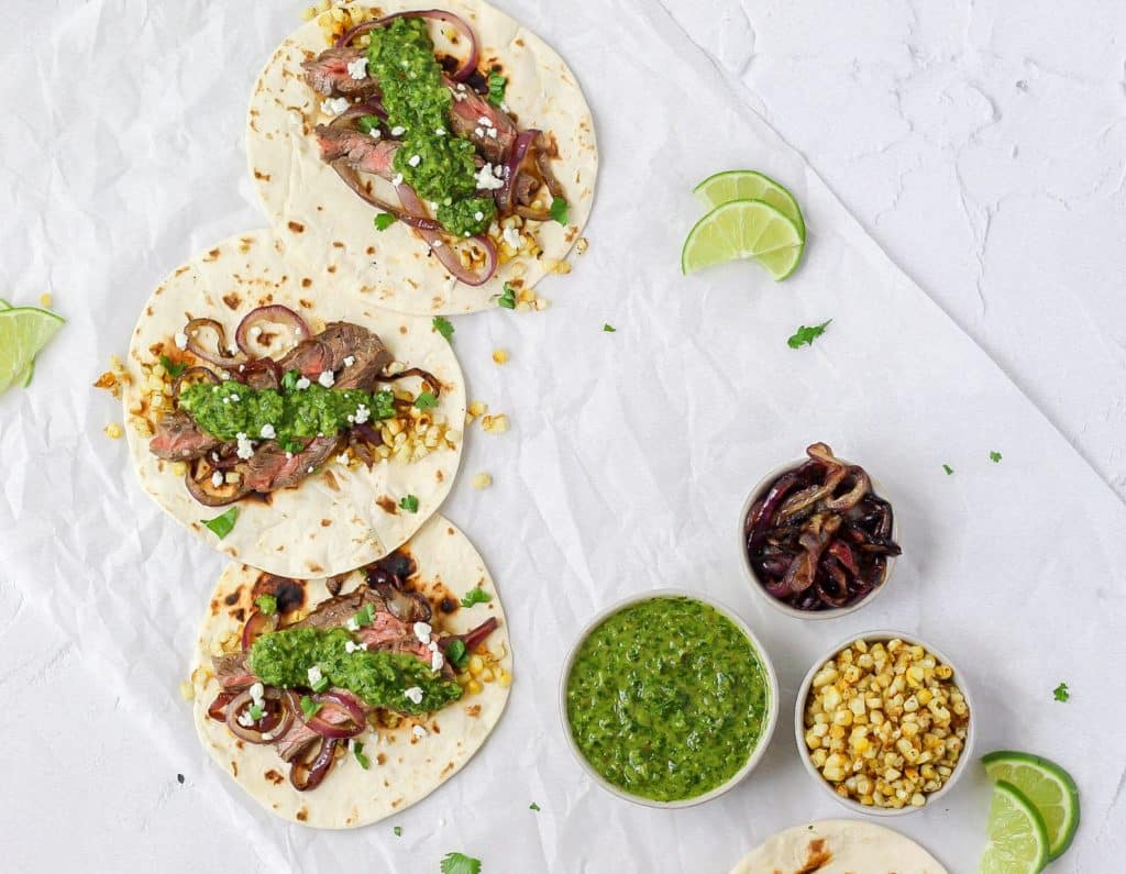 chimichurri steak tacos with grilled onions and corn