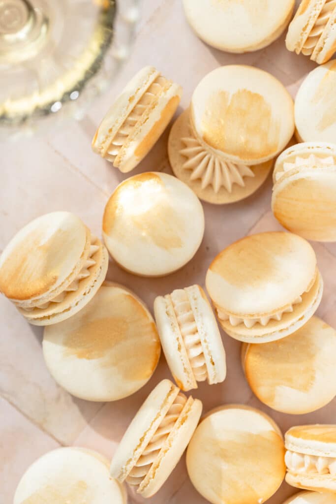 champagne macarons with edible gold paint