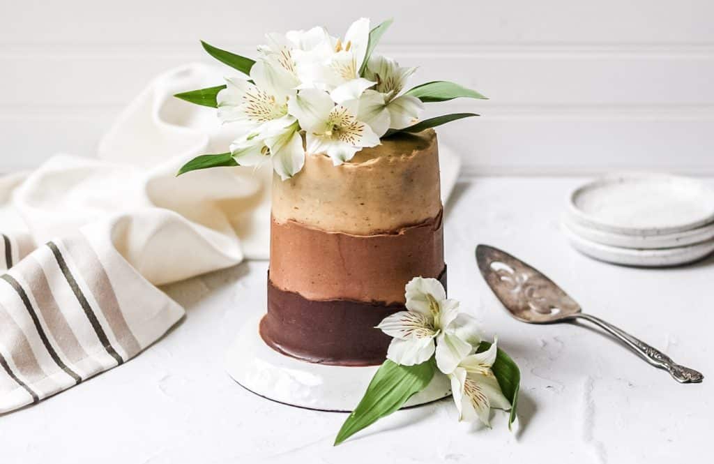 chocolate espresso ombre layer cake topped with fresh flowers