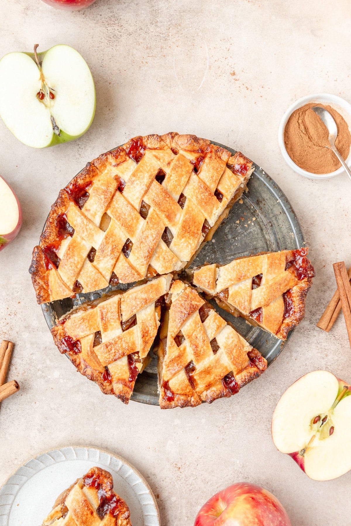 homemade apple pie cut into slices.