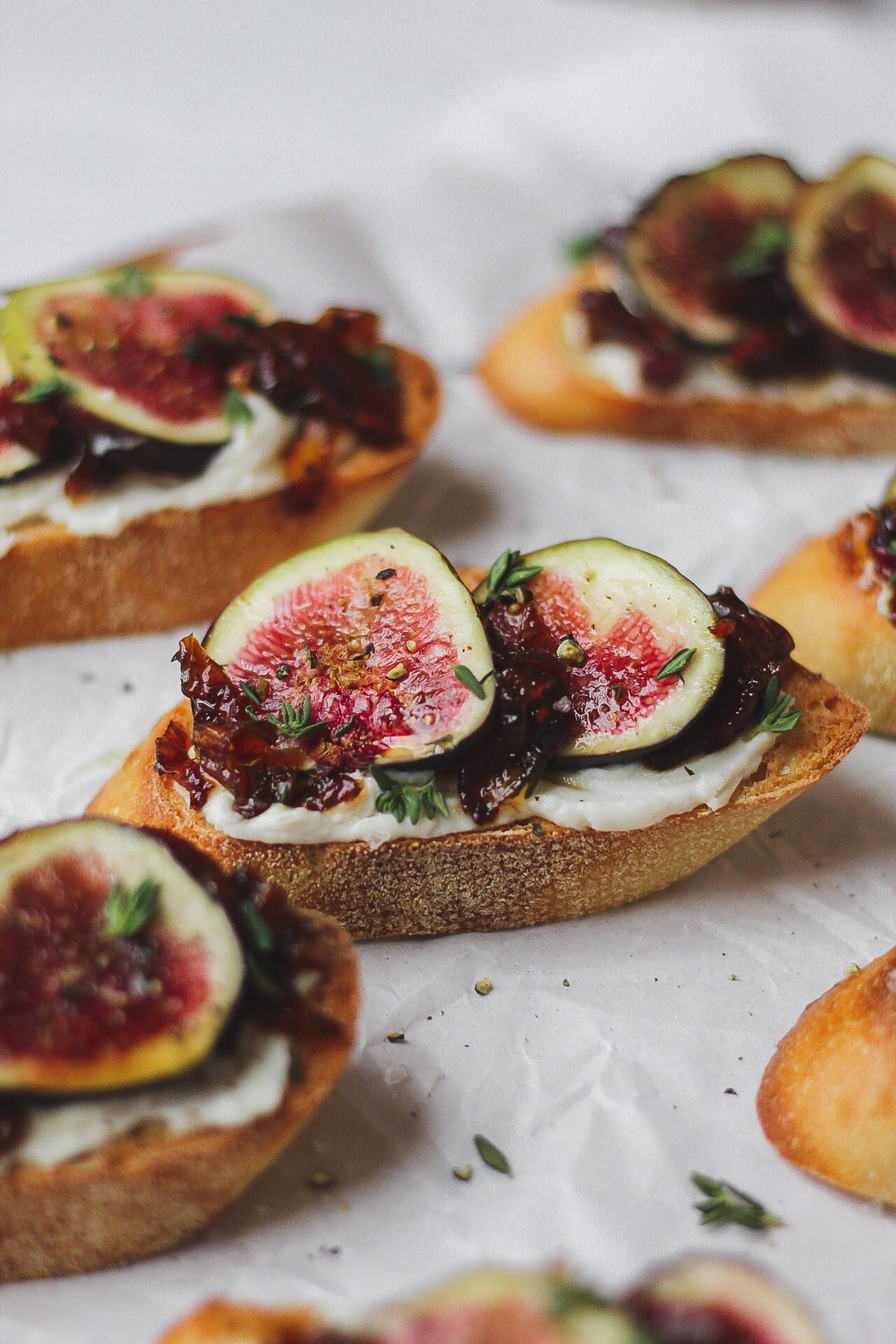 fig and homemade bacon jam crostini with goat cheese, honey, and thyme