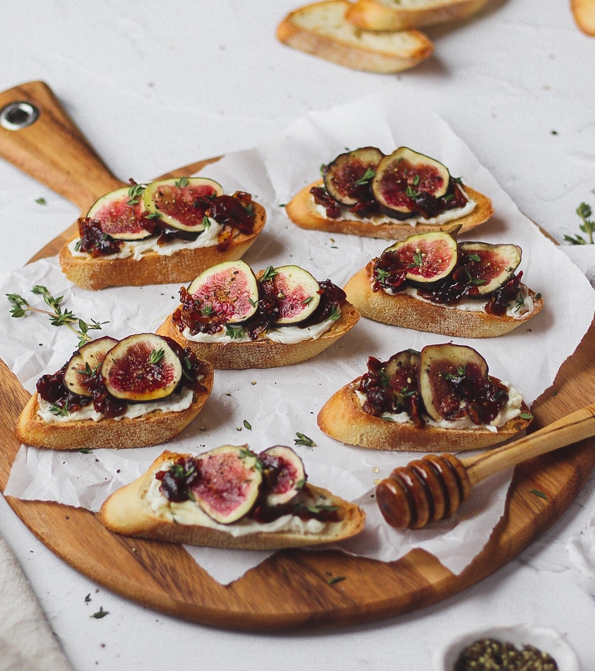 fig and homemade bacon jam crostini with goat cheese, honey, and thyme