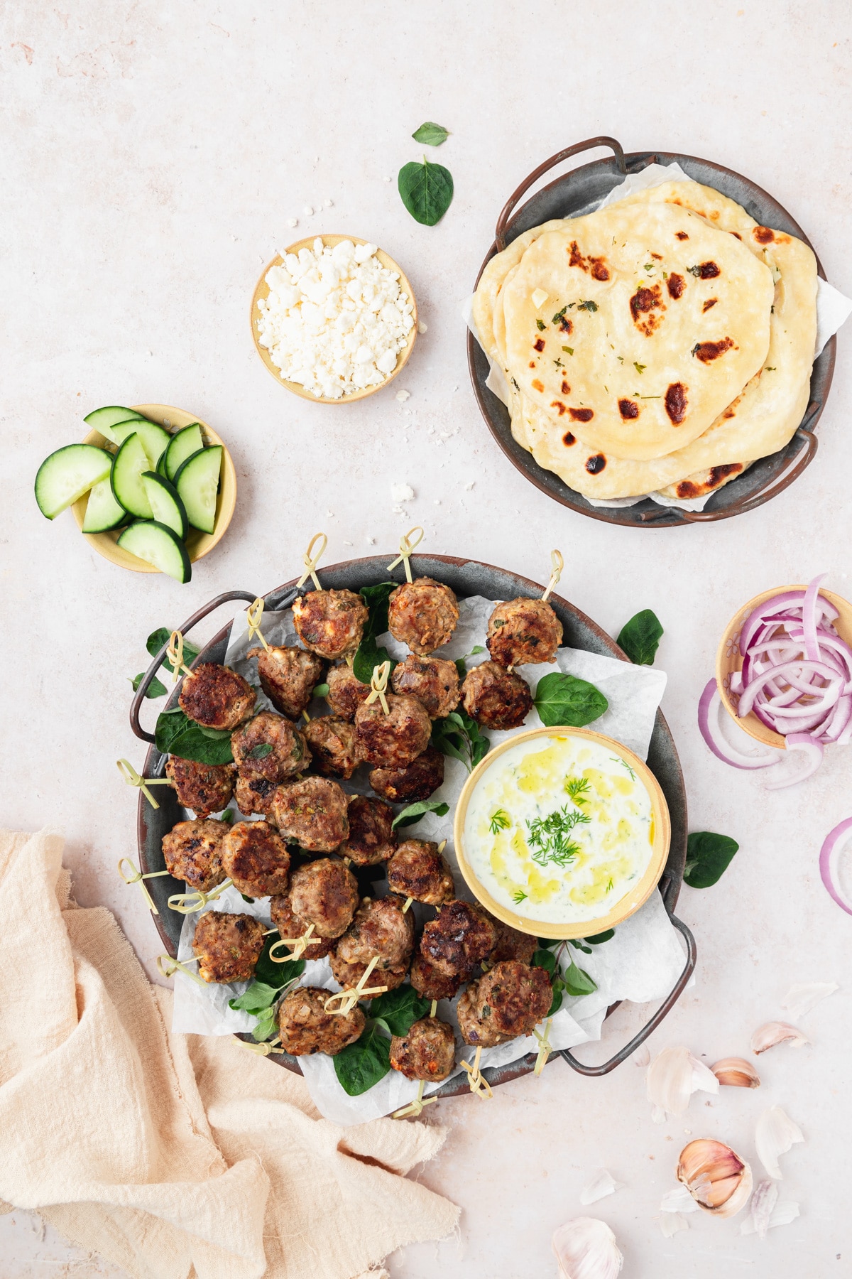 tray of greek lamb meatballs with sourdough naan