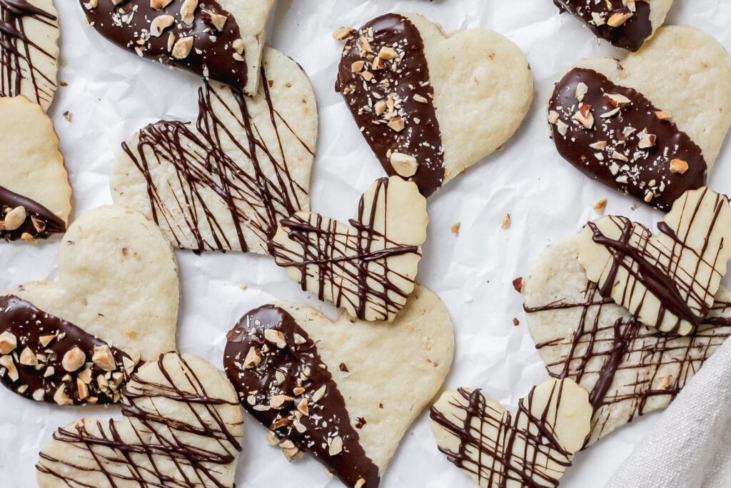 chocolate hazelnut shortbread cookies in heart shapes
