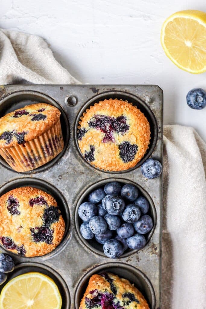 brown butter lemon blueberry muffins in muffin tin