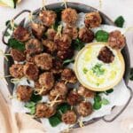 tray of greek style lamb meatballs with yogurt sauce