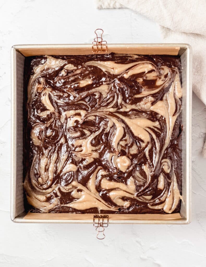 halva brownies before baking with halva swirled on top