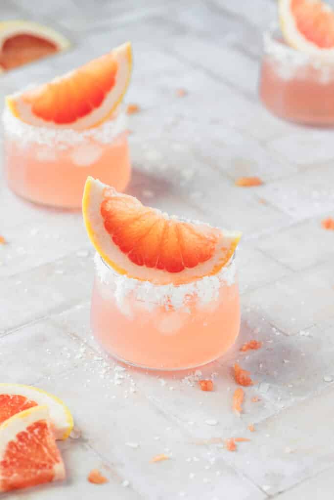 pink cocktail with slice of grapefruit on top