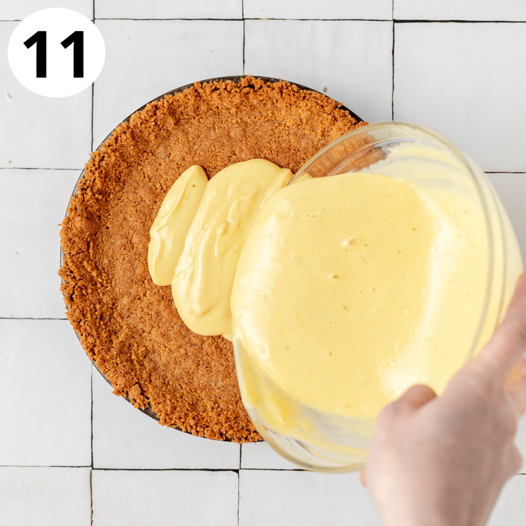 pouring key lime filling into graham cracker crust