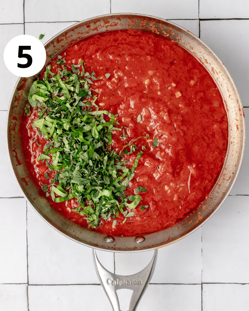 tomato sauce with fresh herbs added on top