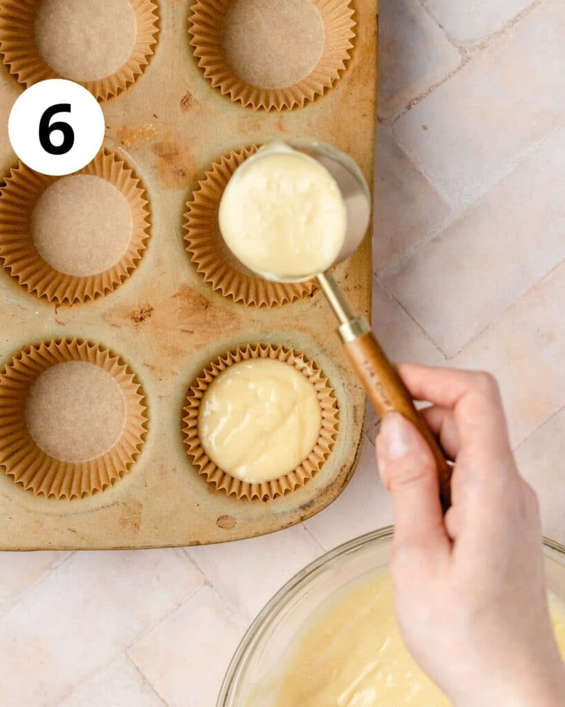 pouring cupcake batter into cupcake pan