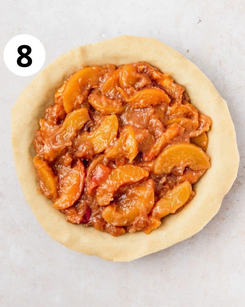 peach pie filling poured into pie crust