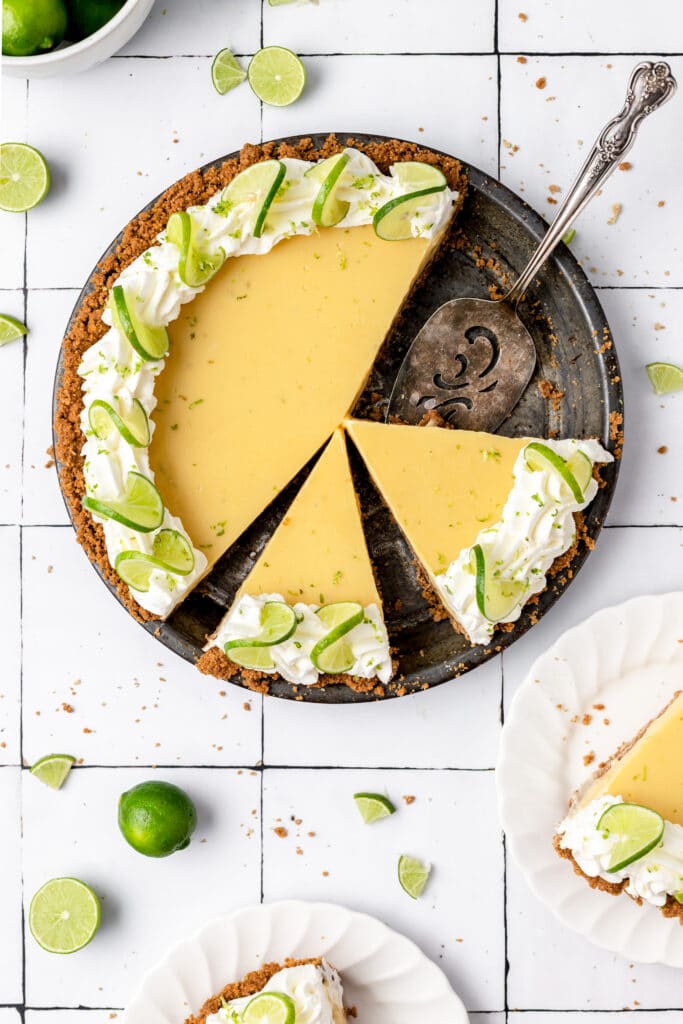 close up of key lime pie with slices cut