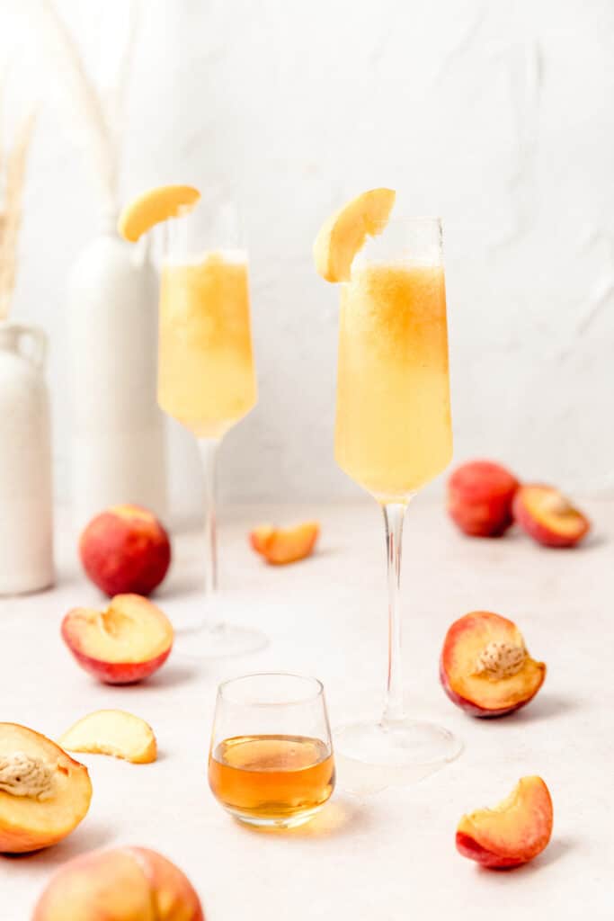 peach bellinis in champagne flutes