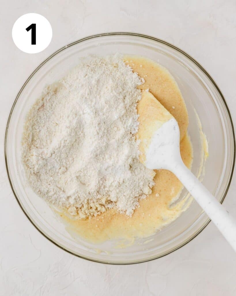 flour on top of creamed butter sugar and eggs 