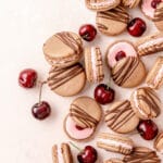 chocolate cherry macarons with fresh cherries