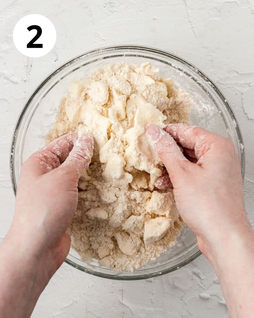 incorporating butter into pie dough mixture