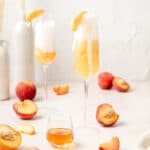 peach Bellini's with sliced peaches on top