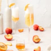 peach Bellini's with sliced peaches on top