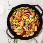 roasted chicken with peaches topped with herbs