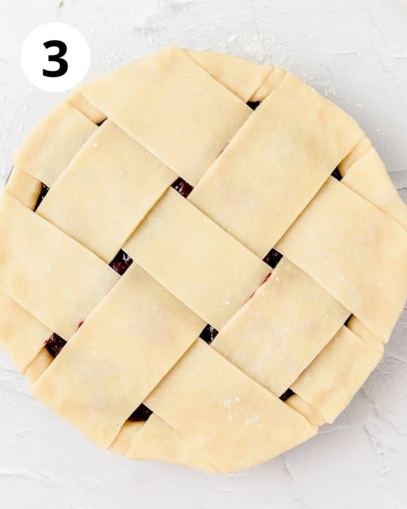 lattice pie crust dough on top of pie pan