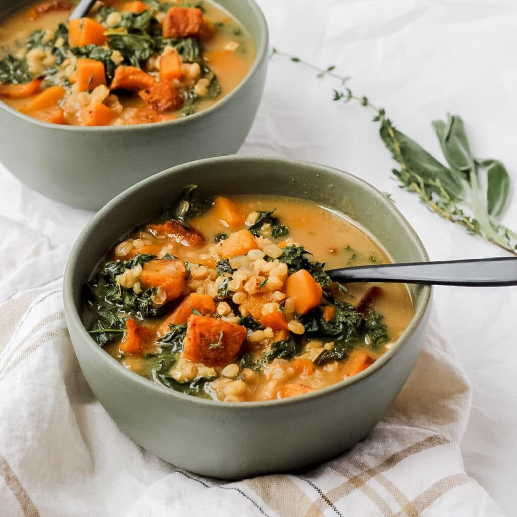 close up shot of barley and sage soup with butternut squash