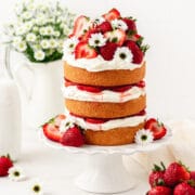 strawberry shortcake layer cake with fresh strawberries and whipped mascarpone