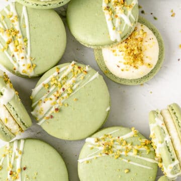 pistachio macarons with white chocolate ganache and chopped pistachios