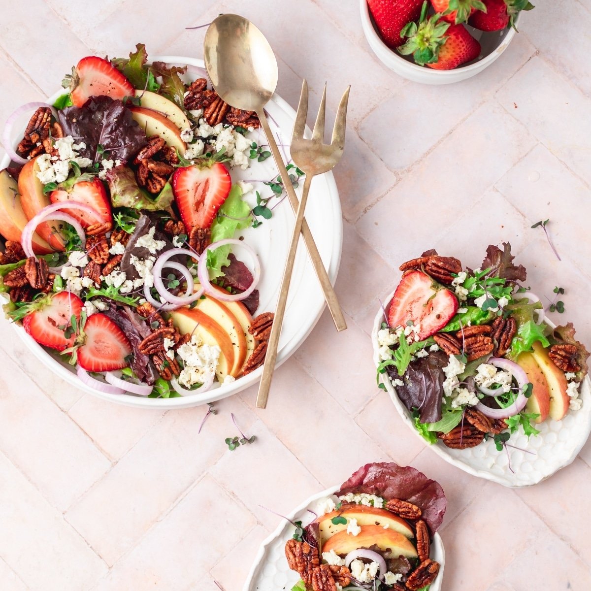 summer salad with strawberries, pecans, goat cheese, and lemon vinaigrette