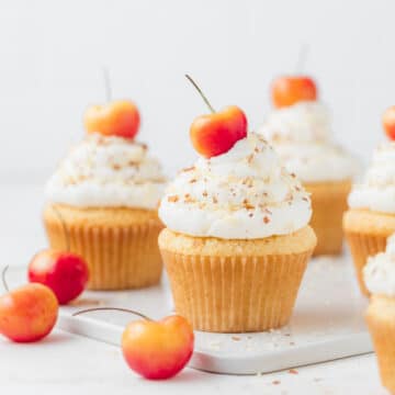 rainier cherry and almond cupcakes with cherries on top