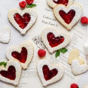 close up shot of heart shaped raspberry linzer cookies