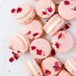 close up shot of white chocolate rose macarons