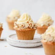 close up shot of almond cupcakes with swiss meringue buttercream