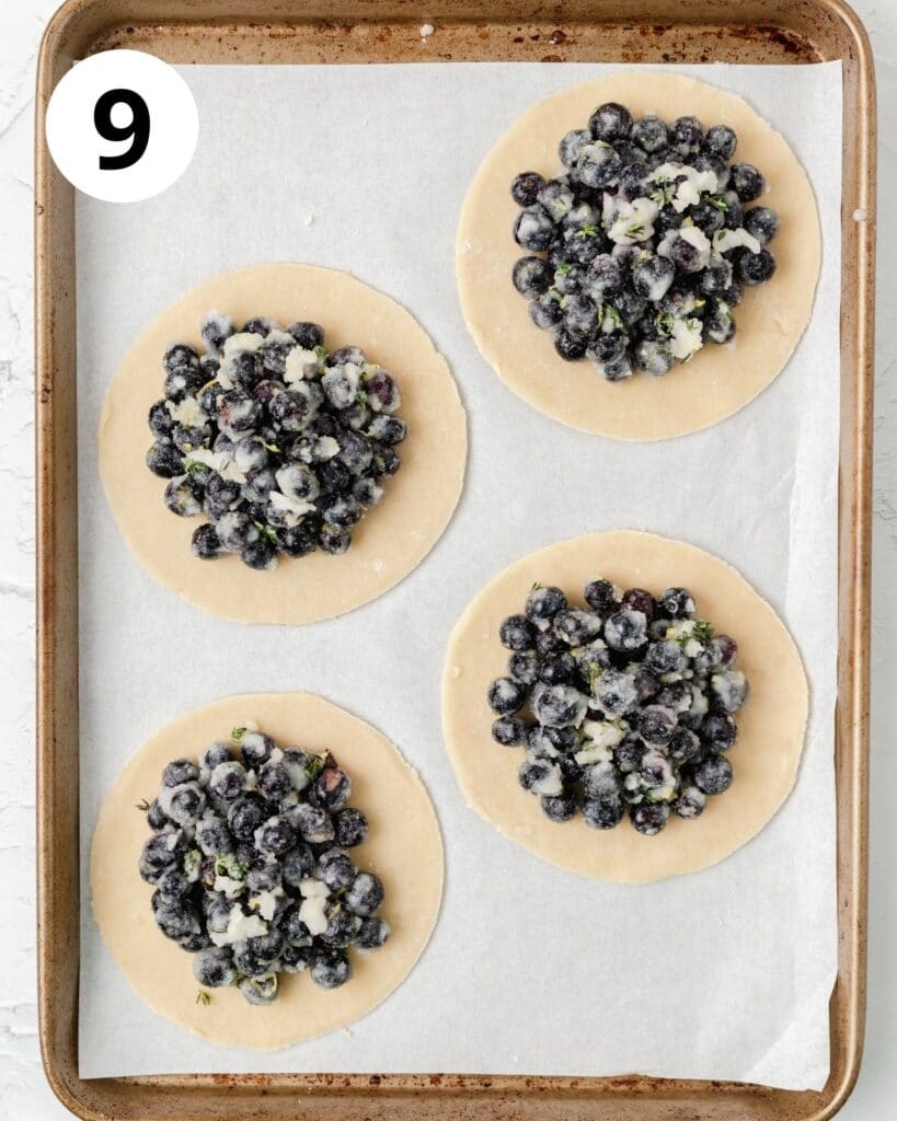 blueberry galette filling on pie dough circles