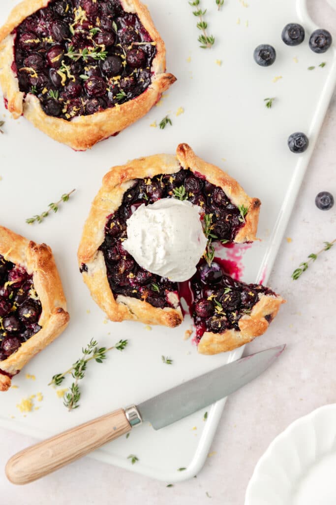 mini blueberry galettes with ice cream on top