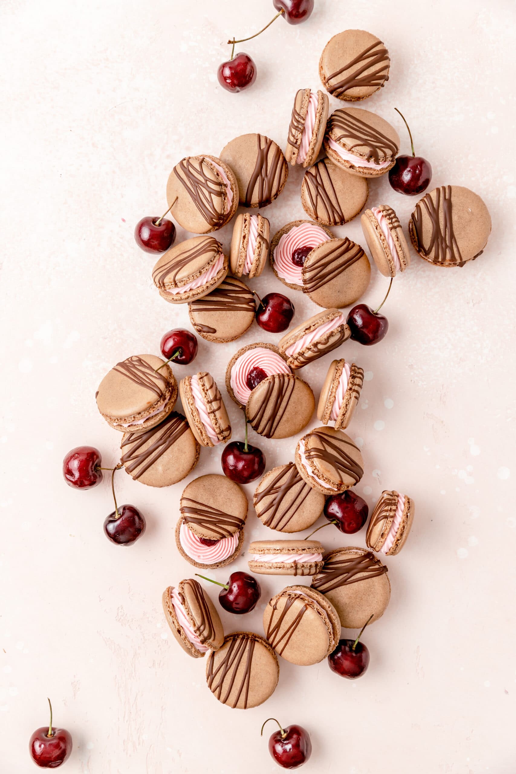chocolate cherry macarons drizzled with dark chocolate.