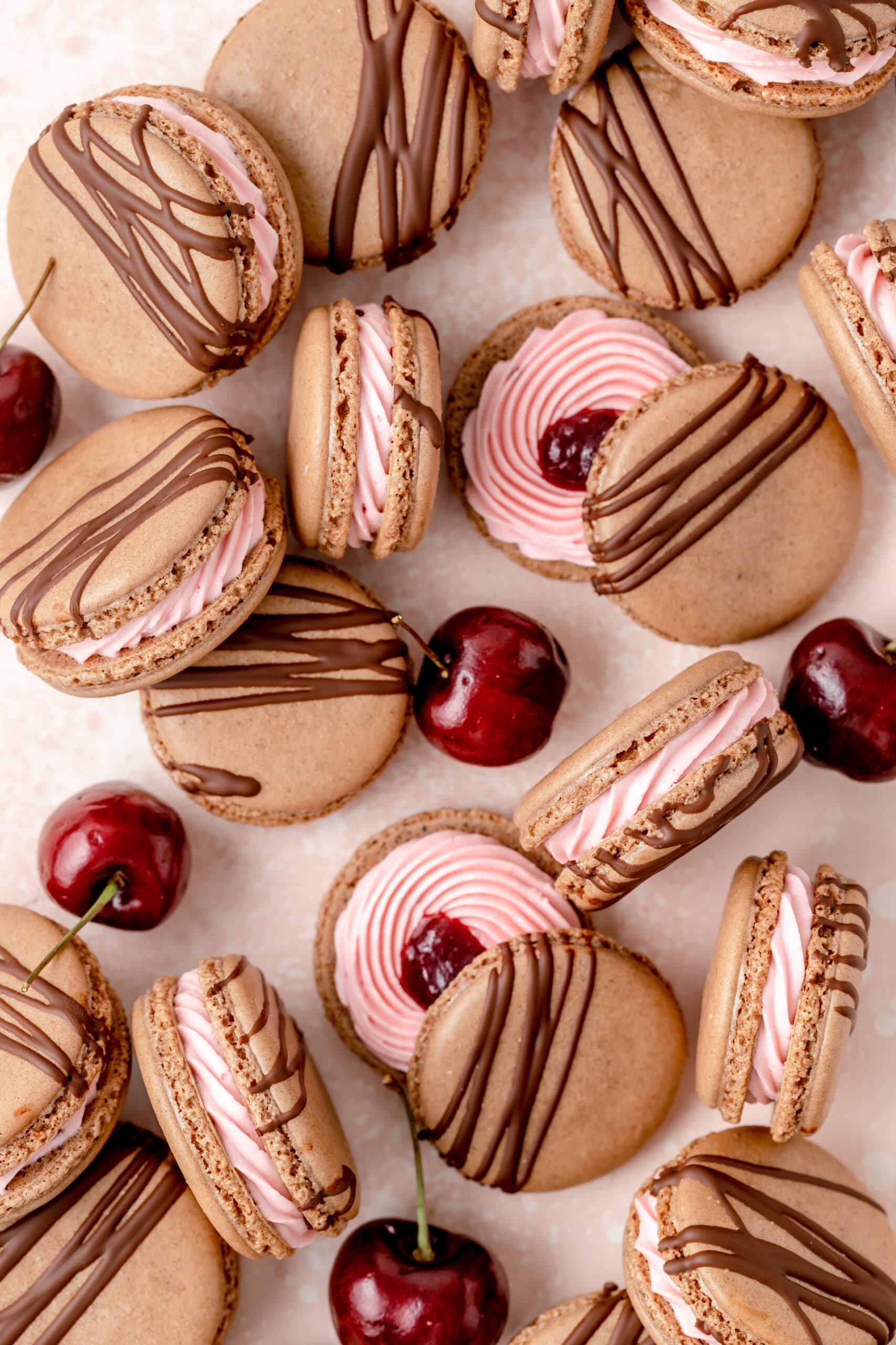 close up of chocolate cherry macarons.