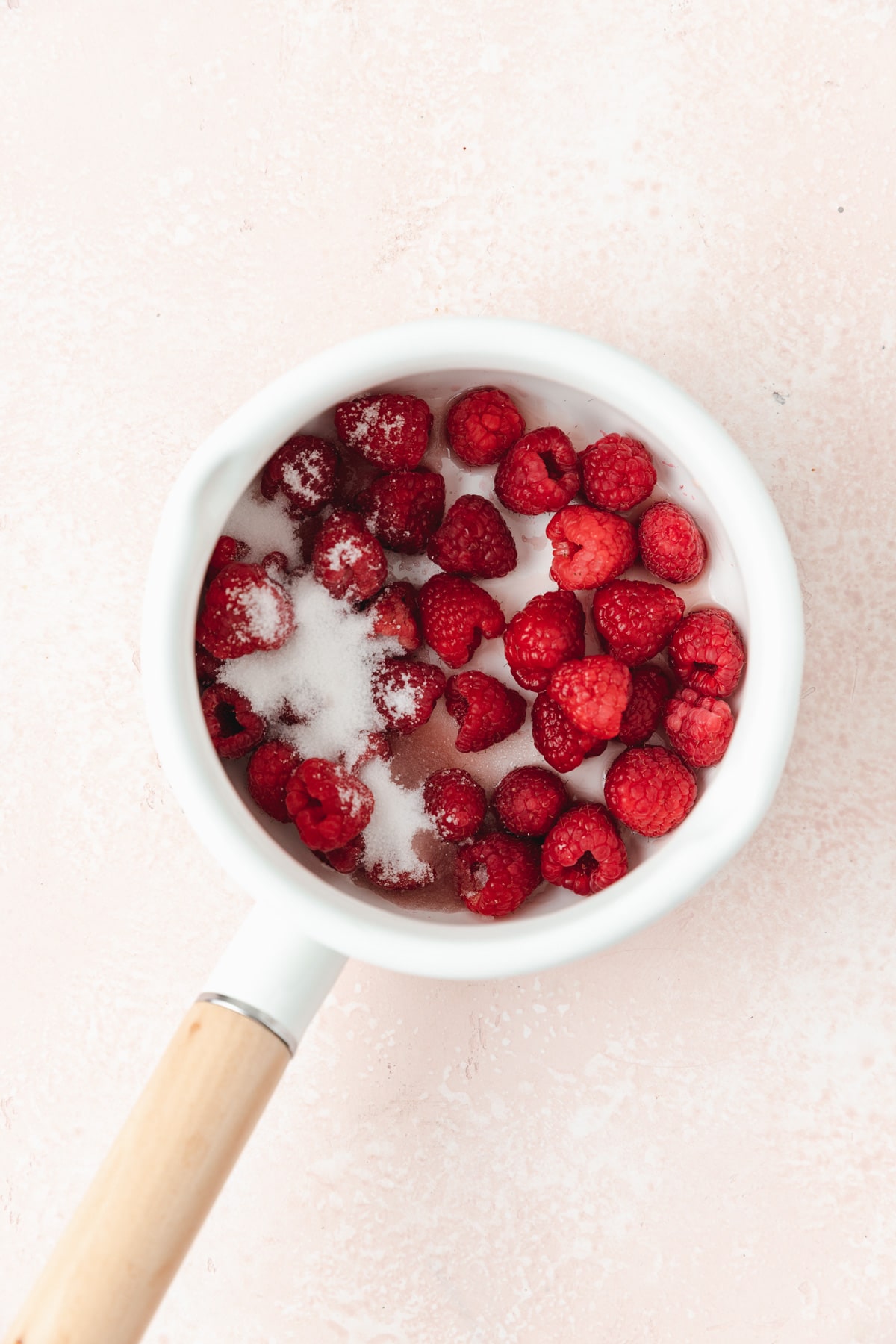 raspberries and chambord in pot 