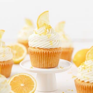 close up shot of meyer lemon cupcakes with candied lemons.