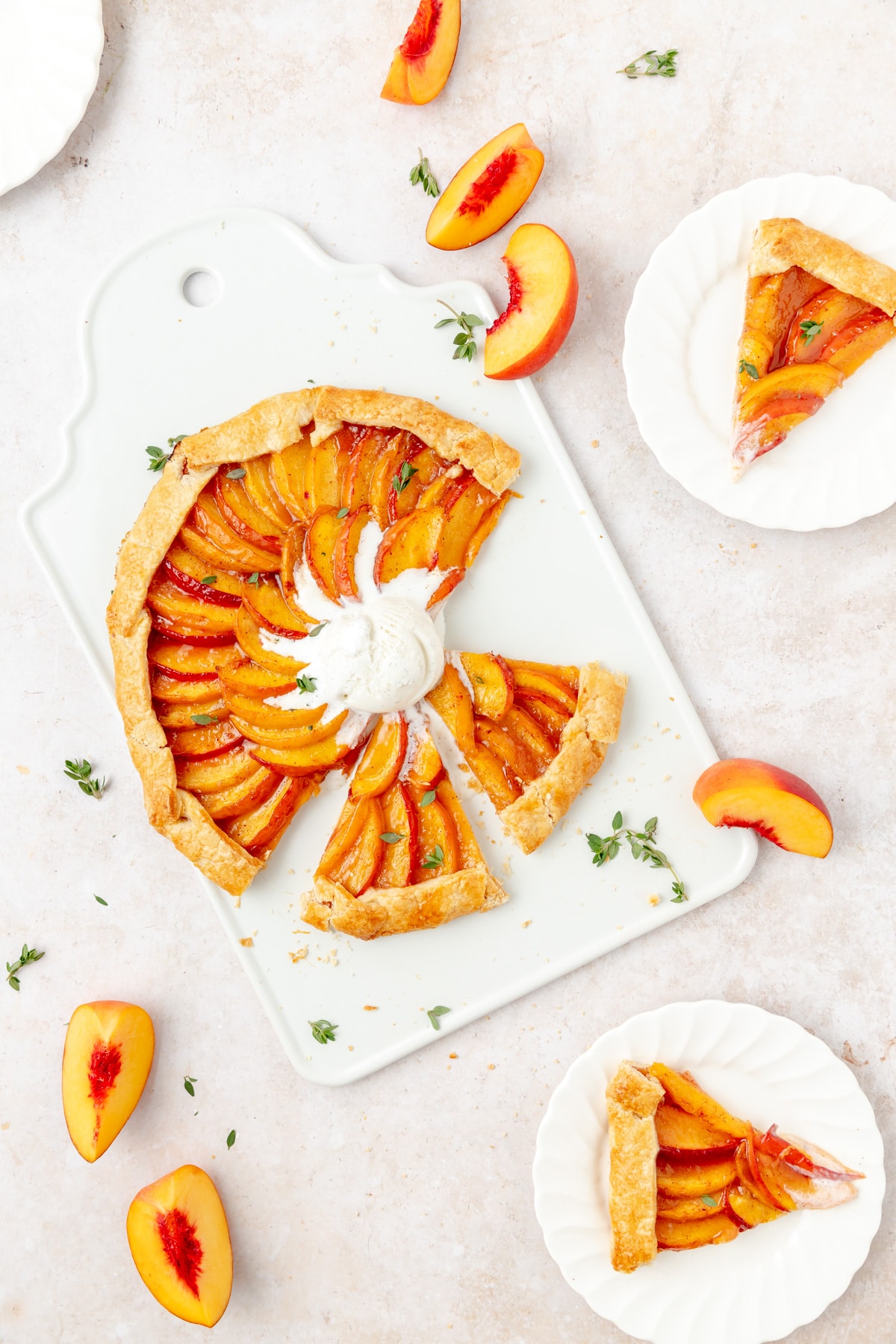 peach thyme galette with vanilla ice cream, cut into slices