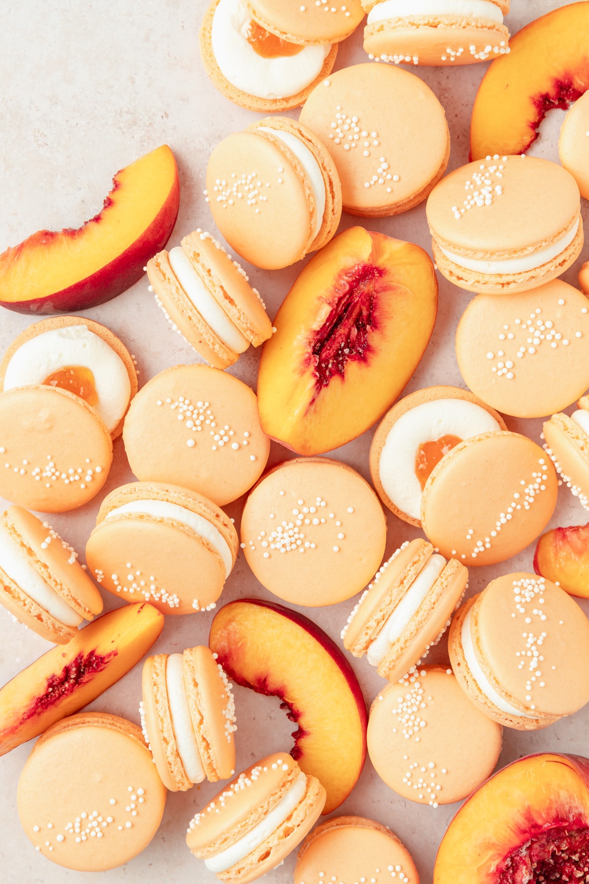 peach macarons with fresh peaches and whipped cream 