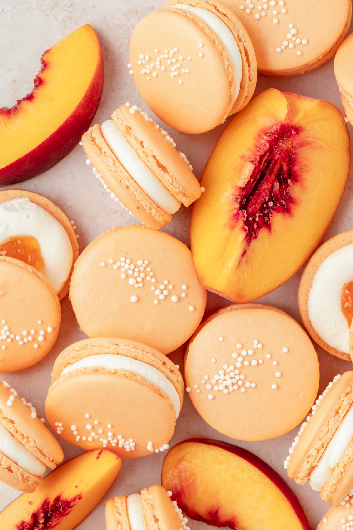 peach macarons with fresh peaches