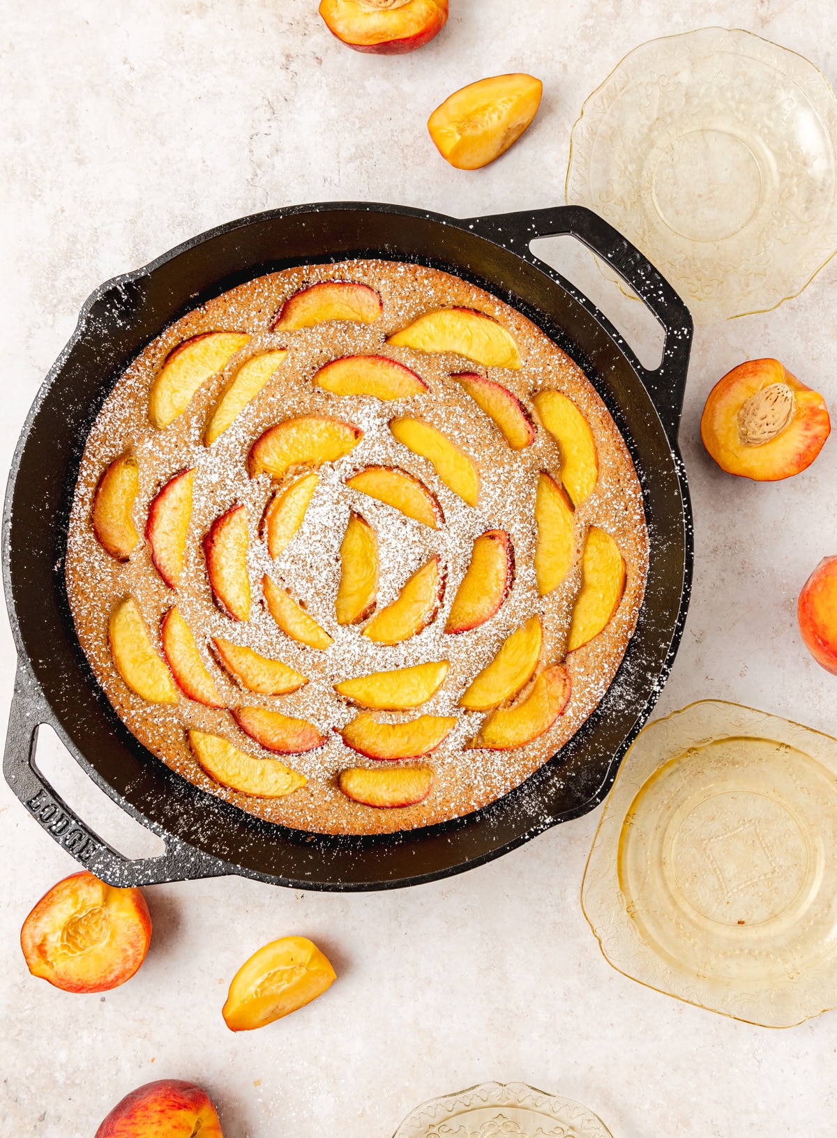 brown butter peach skillet cake dusted with powdered sugar