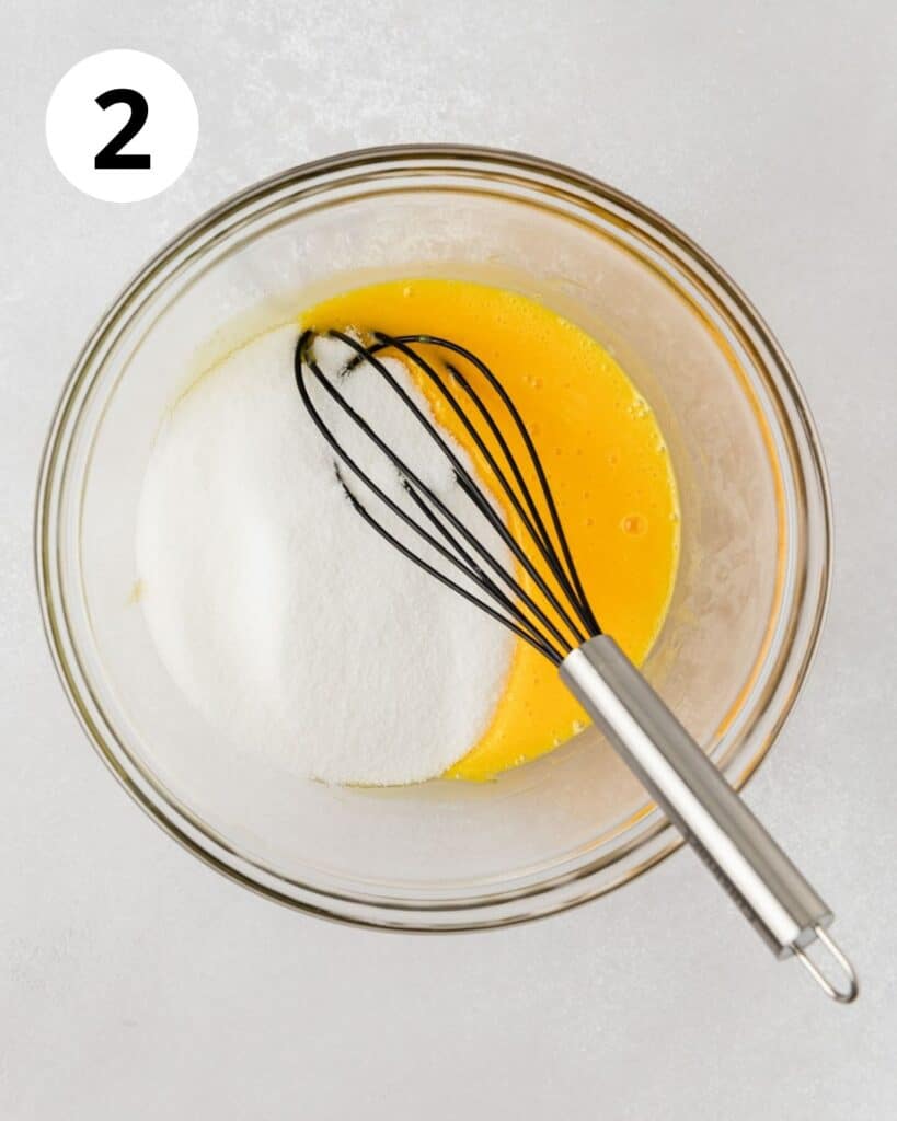 whisking egg yolks lemon and sugar