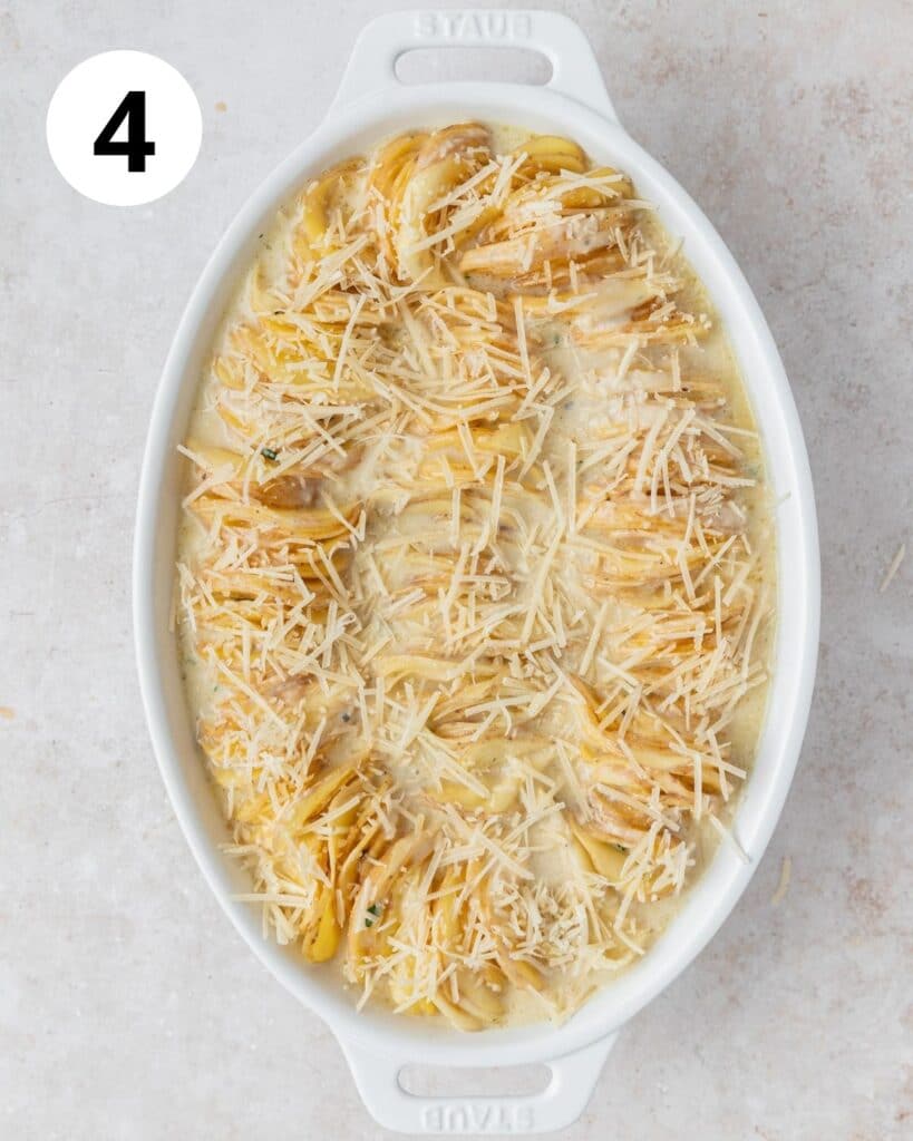 scalloped potatoes in baking dish with cheese on top