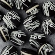 close up shot of black cocoa mummy macarons