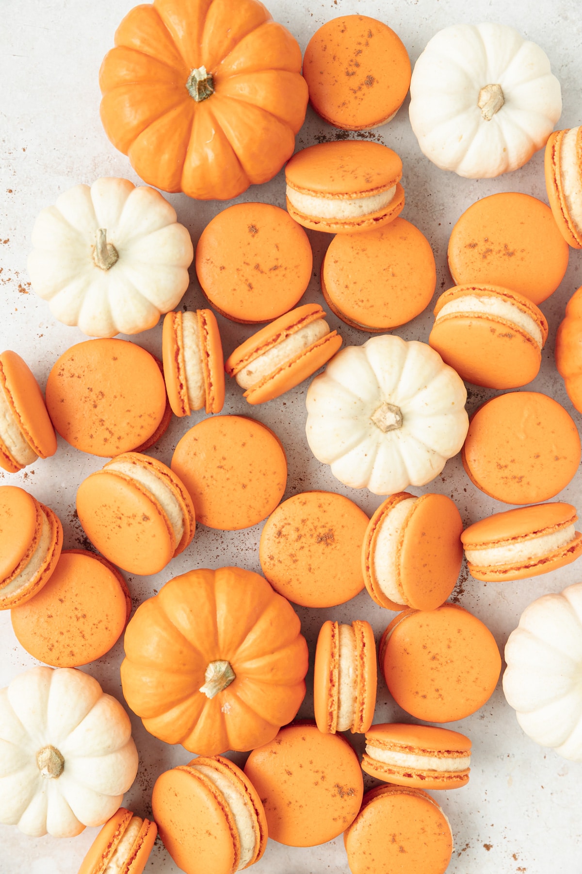 pumpkin macarons with spiced cream cheese frosting